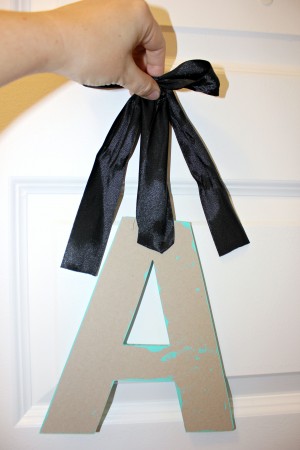 Adding ribbon to wooden letter monogram